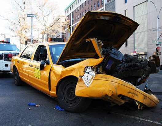 "the innards of a crashed taxicab on broadway and 115th st., new york city."